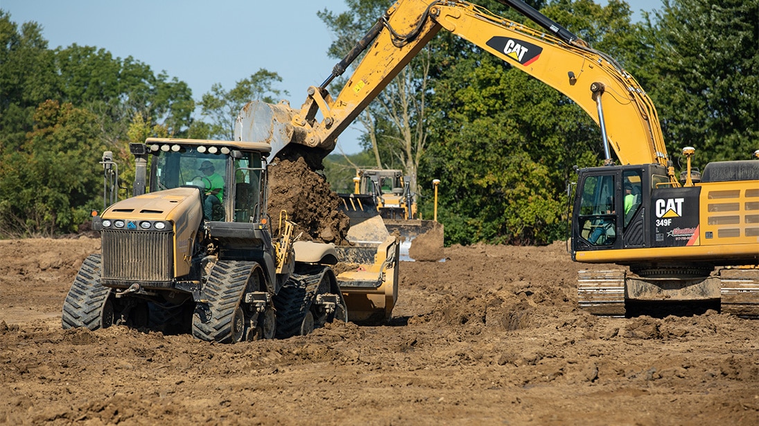Valenti-Held Contractor/Developer earthwork contractor employees grading land.